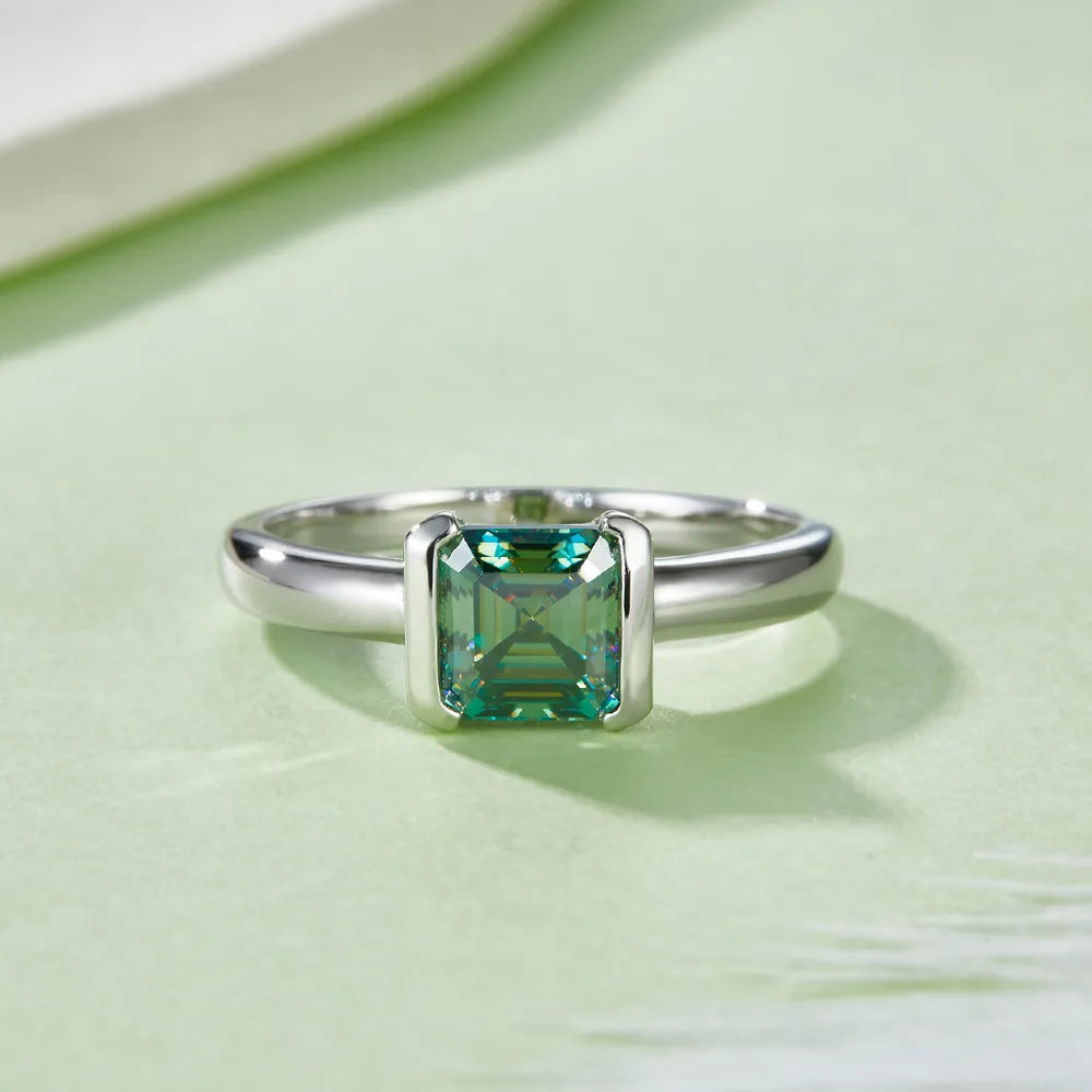 Elegant 1 carat moissanite ring in silver settings, featuring a beautiful emerald cut gemstone
