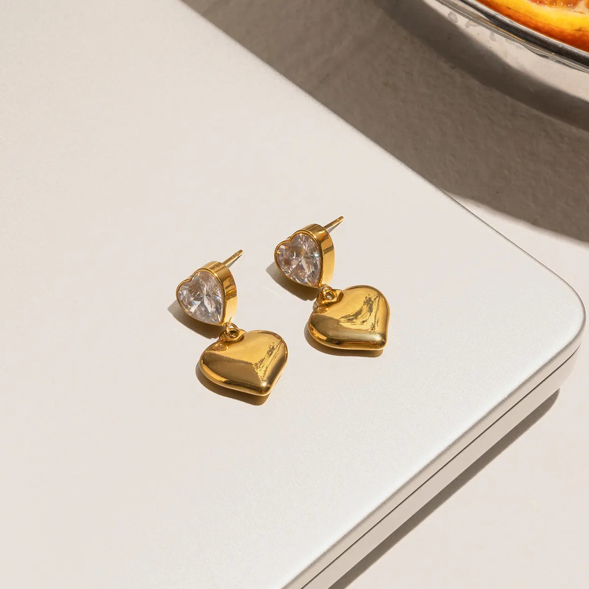 Trendy 18K gold heart earrings with sparkling gemstones for a stylish look