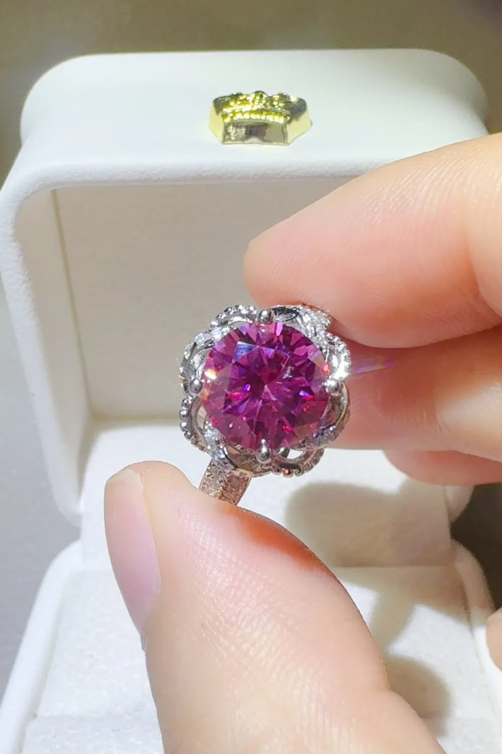 Trendsi 2 carat moissanite flower ring in vibrant purple displayed on a ring box