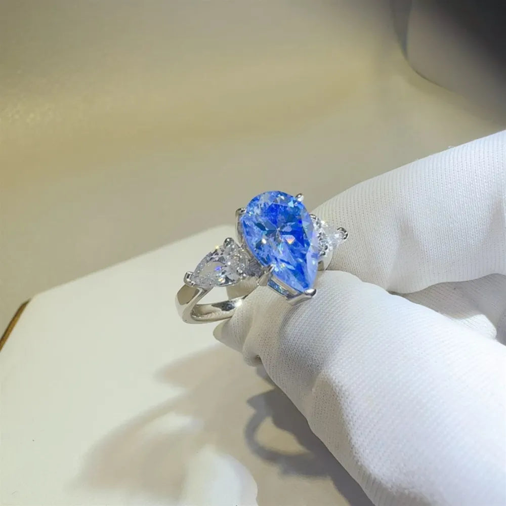Trendsi 2 carat moissanite teardrop ring with shimmering side stones in elegant silver setting