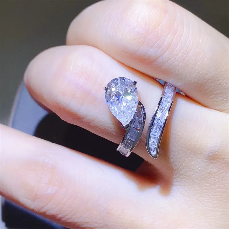 Elegant 3 carat moissanite ring with a pear-shaped center stone and sleek band design