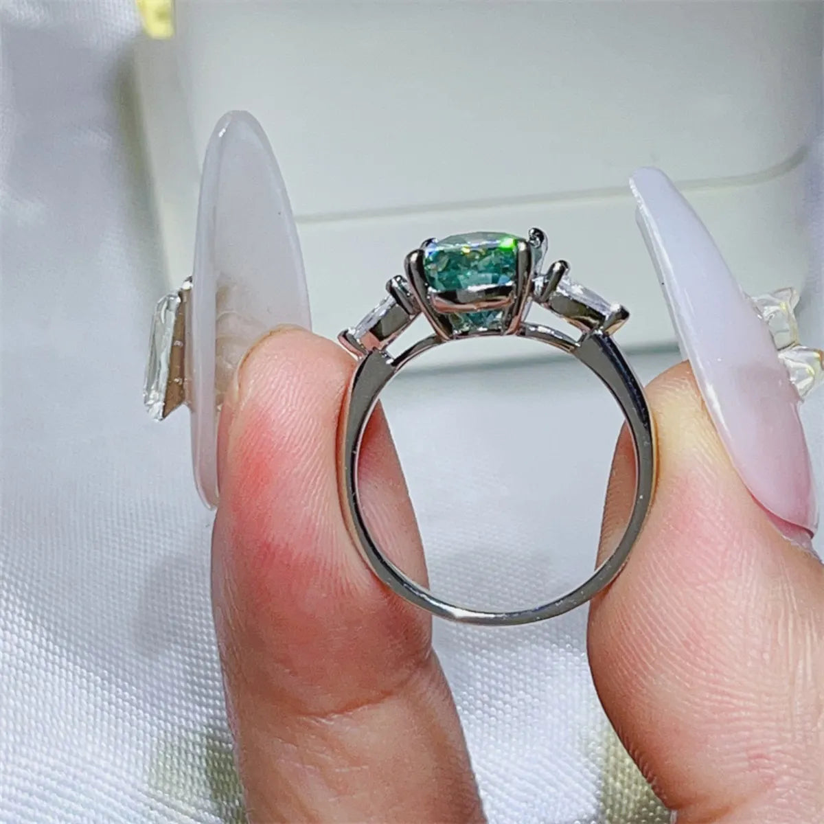 Elegant 3 carat moissanite ring showcased in silver setting with brilliant cut stones