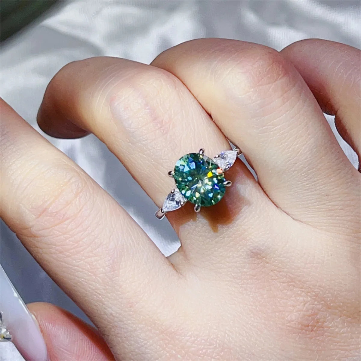 Elegant 3 carat moissanite ring featuring a vibrant center stone and sparkling side accents