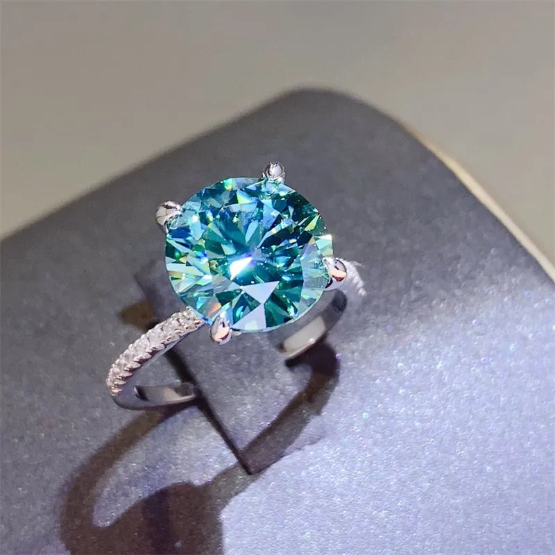 Stunning 5 carat moissanite ring with a vibrant blue stone and elegant band