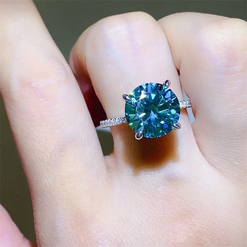 Stunning 5 carat moissanite ring set on a delicate band displaying brilliant color and sparkle