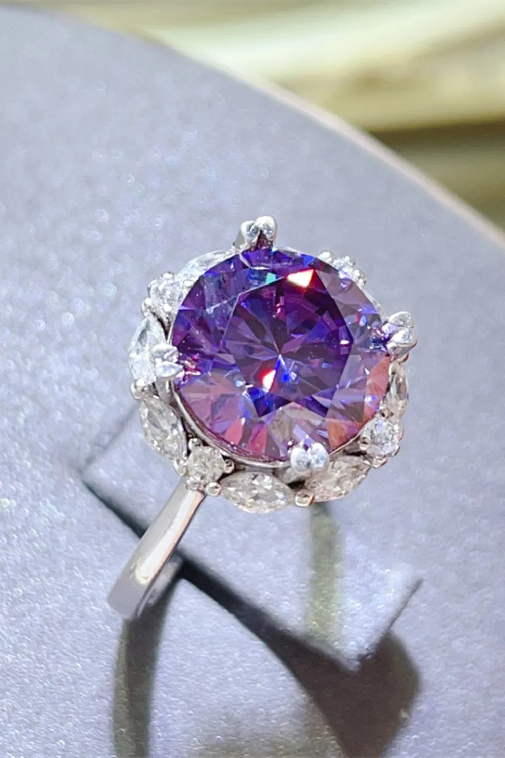 Stunning 5 carat moissanite ring with purple center stone and diamond accents for elegant occasions