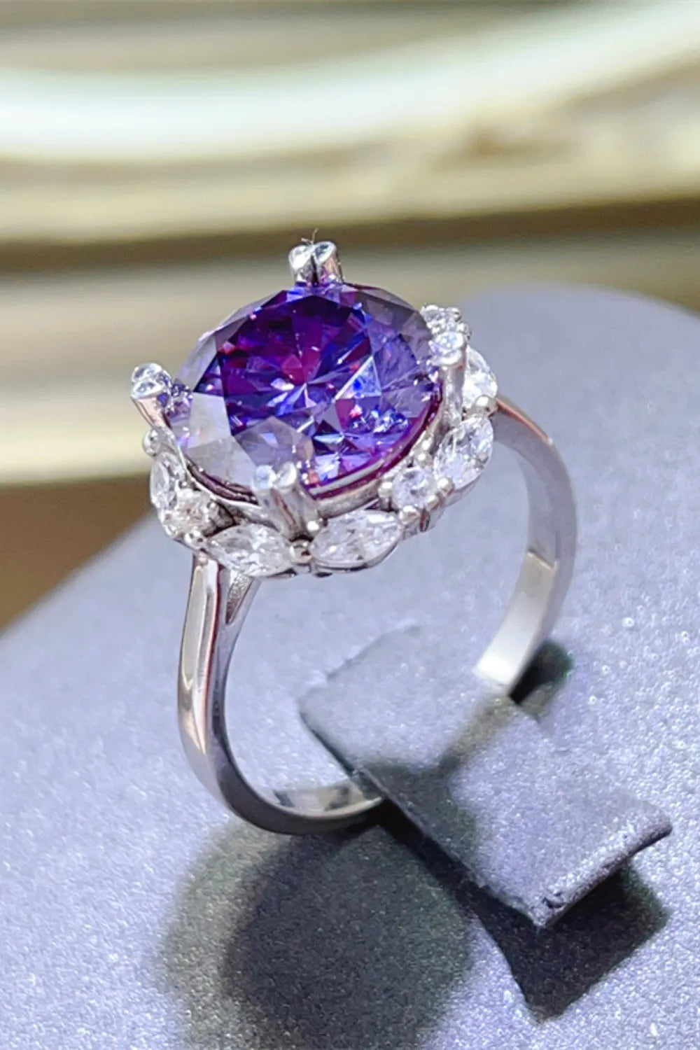Trendy silver ring showcasing a stunning 5 carat moissanite ring with purple hues and elegant design
