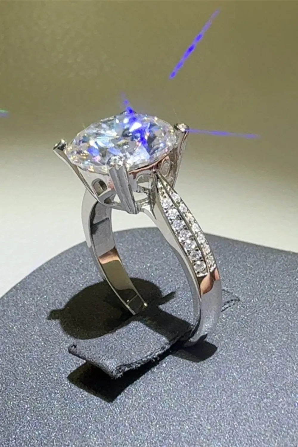 Elegant 5 carat moissanite ring with sparkling side stones and a stunning centerpiece