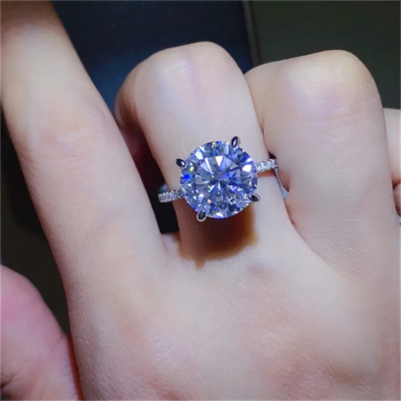 Stunning 5 carat moissanite ring on a hand, showcasing its brilliant sparkle and elegant design