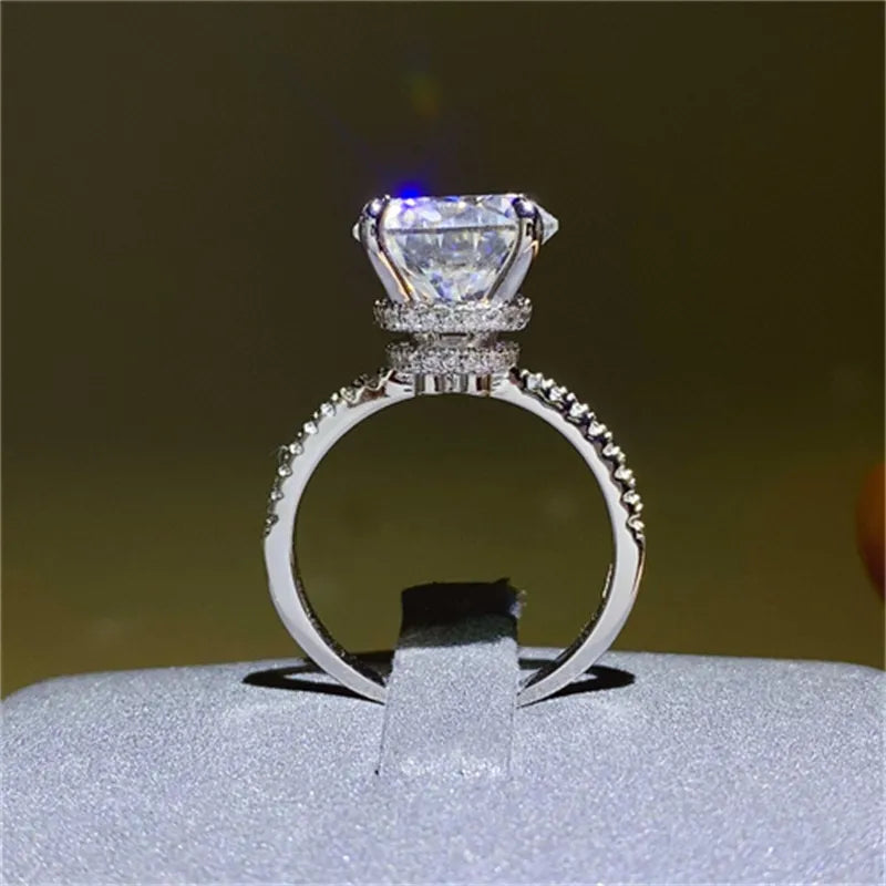 Elegant 5 carat moissanite ring with a sparkling center stone and detailed band design