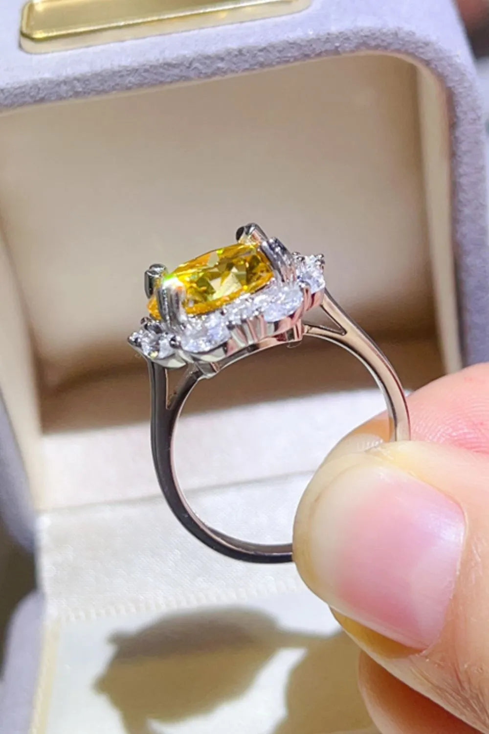 Elegant 5 carat moissanite ring with a stunning yellow center stone and sparkling accents