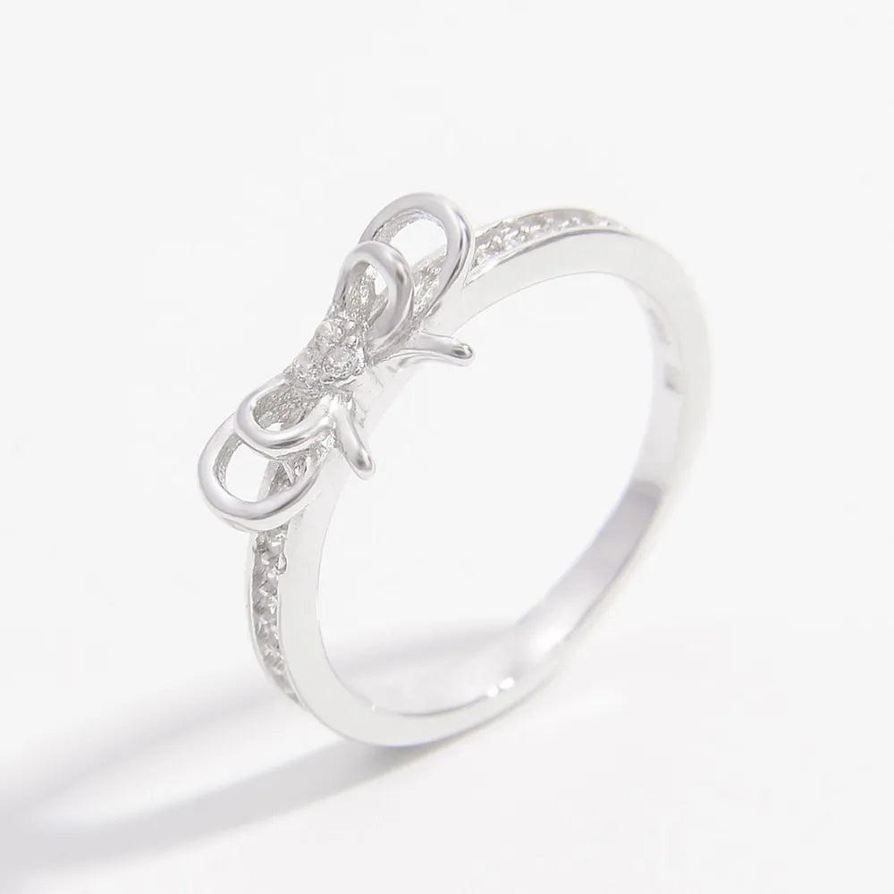 925 sterling silver bow ring with sparkling details on a polished band