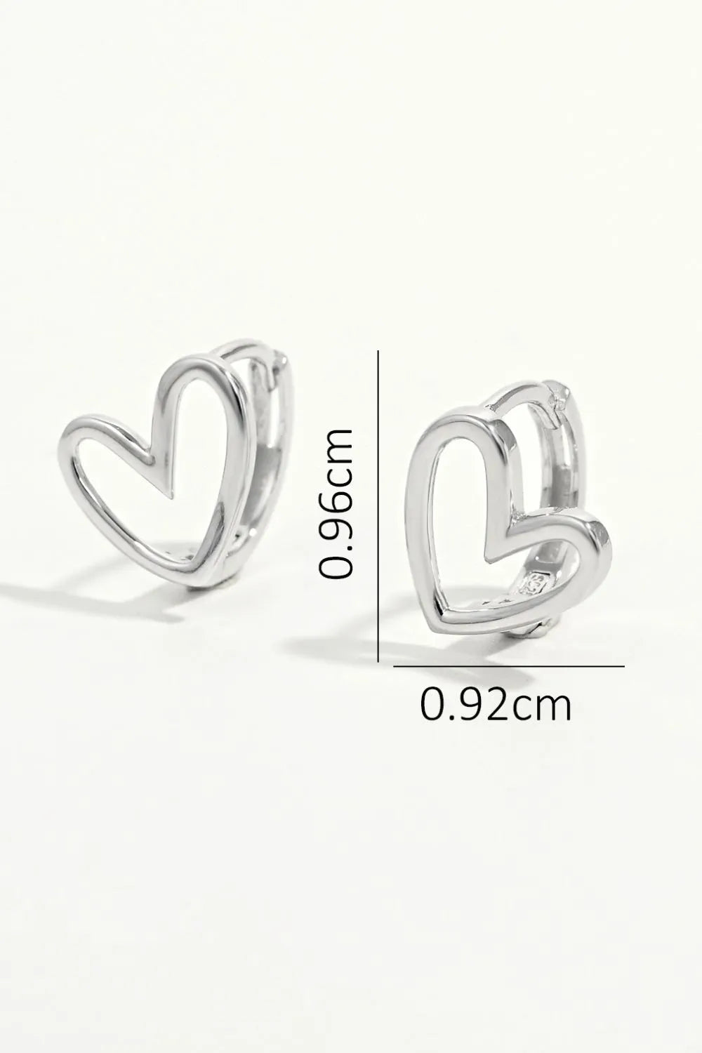 Trendy 925 sterling silver heart earrings with a unique double heart design for stylish accessorizing