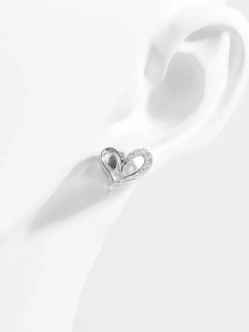 Elegant 925 sterling silver heart earrings with dazzling accents for a stylish look