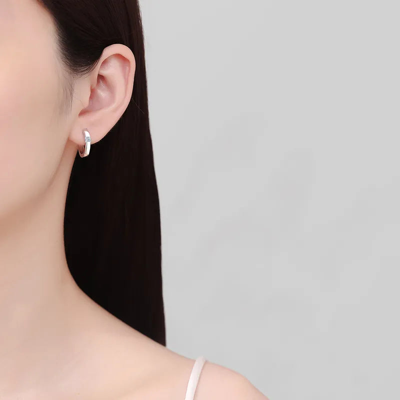 Trendsi 925 sterling silver huggie earrings shown on a model's ear for a stylish look