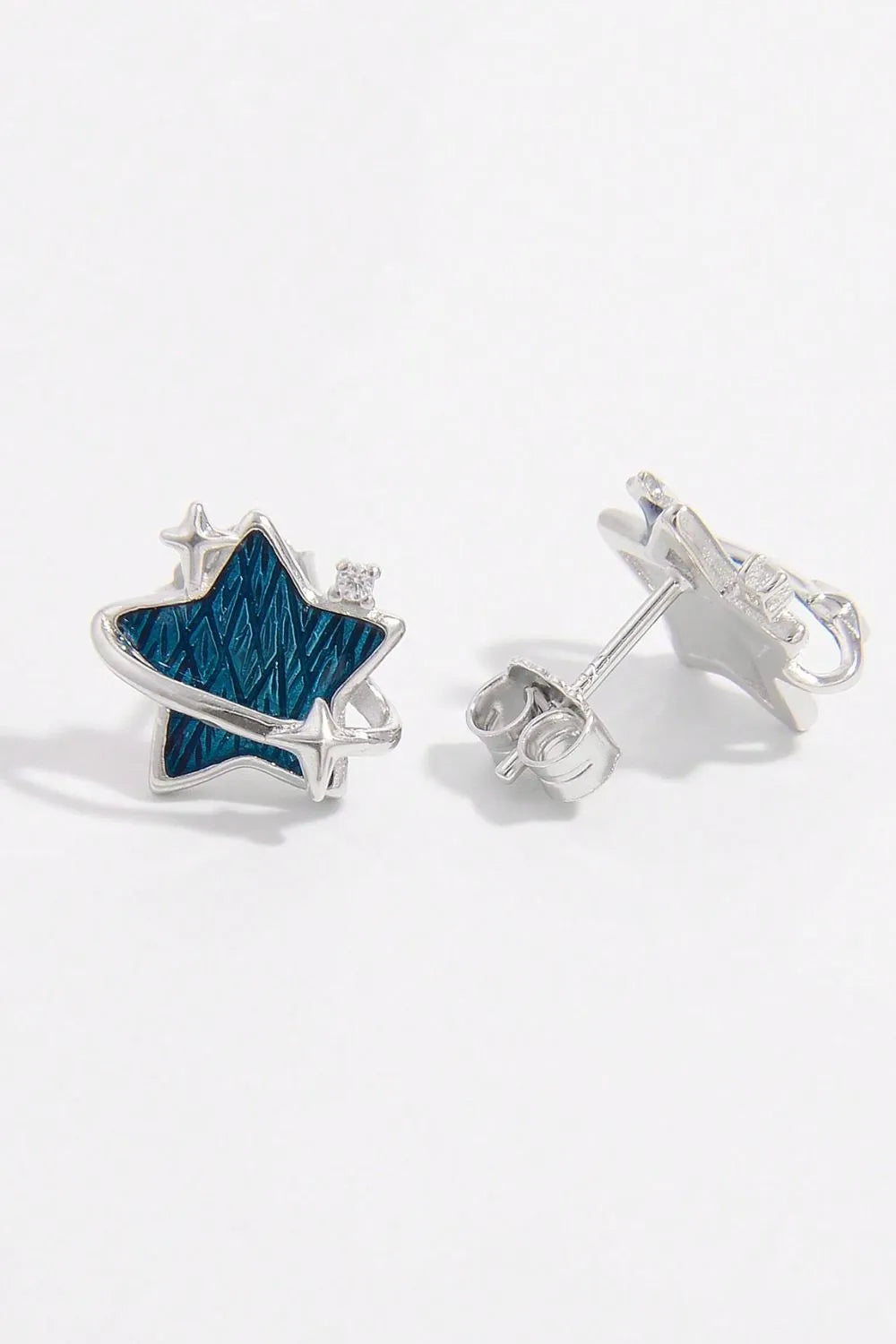 925 sterling silver star earrings with a blue textured design and sparkling accents