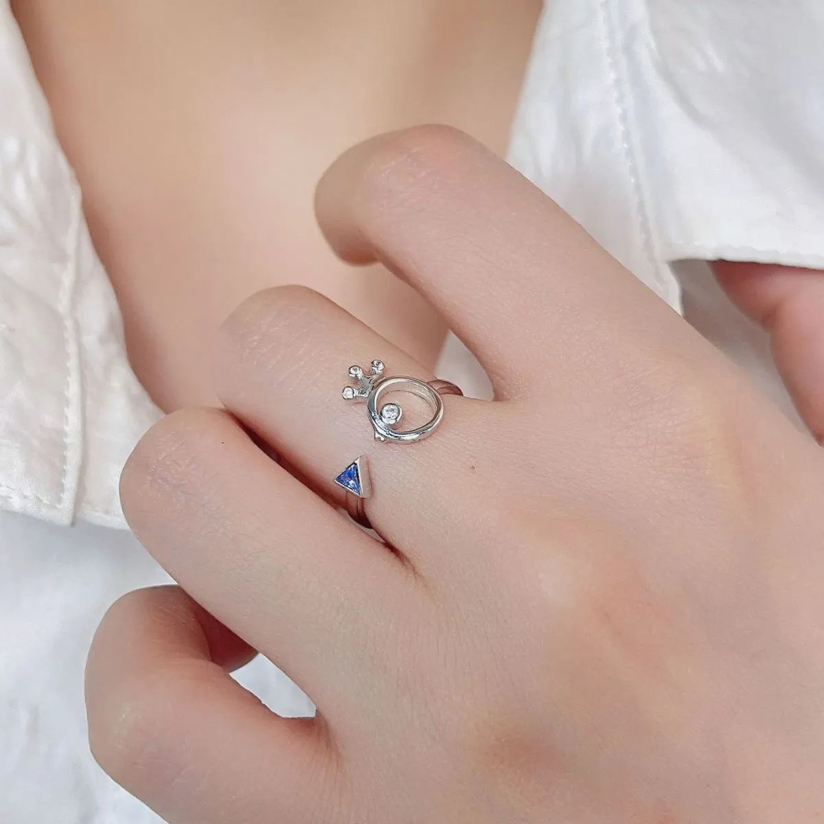 925 sterling silver zircon ring featuring a unique design with a triangular blue stone