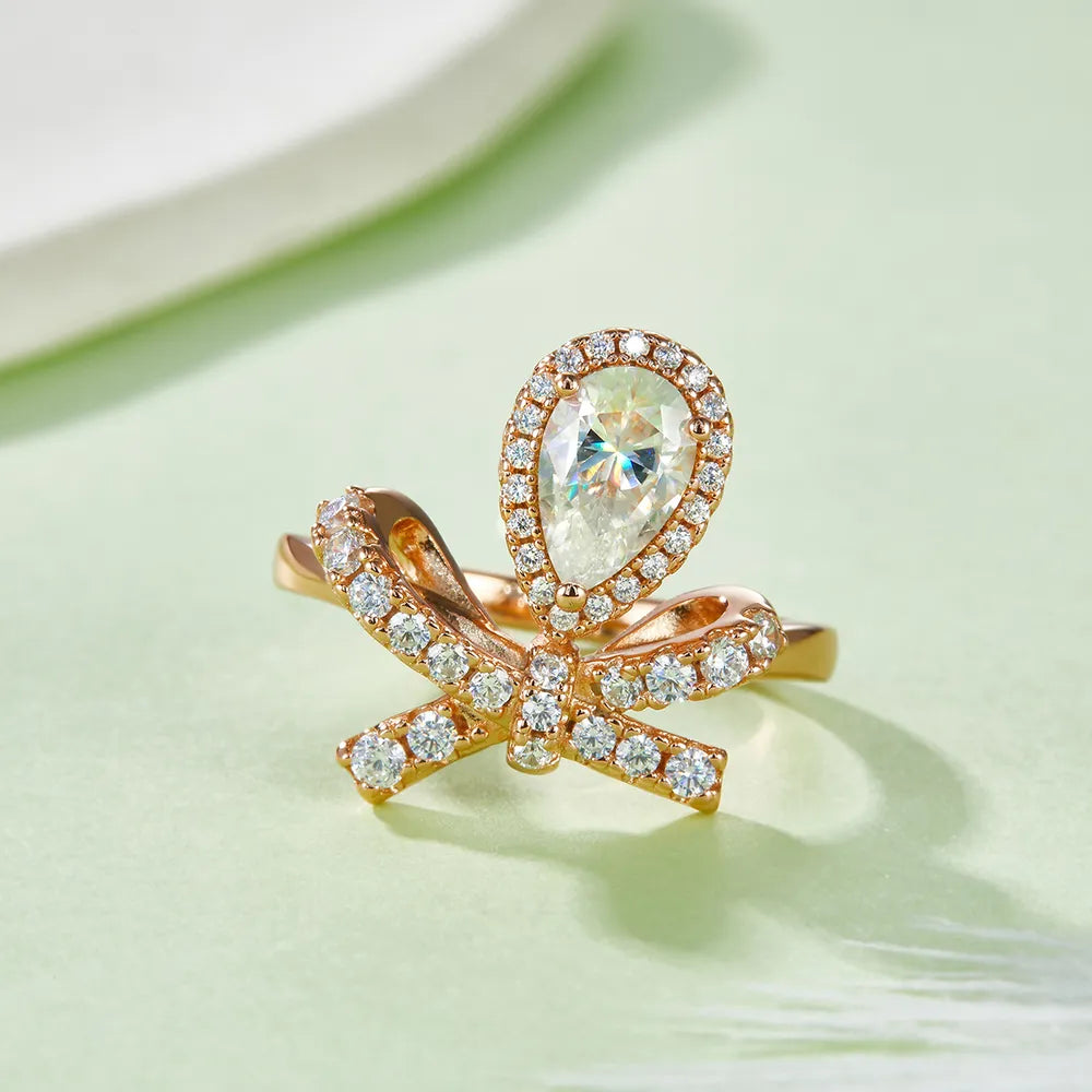 Trendsi affordable moissanite rings featuring a bow design with sparkling stones and a pear-shaped center gem