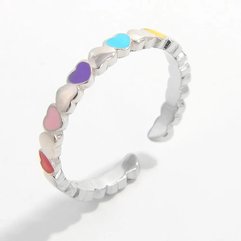 Colorful heart ring for women featuring a playful design with multiple heart shapes in vibrant colors
