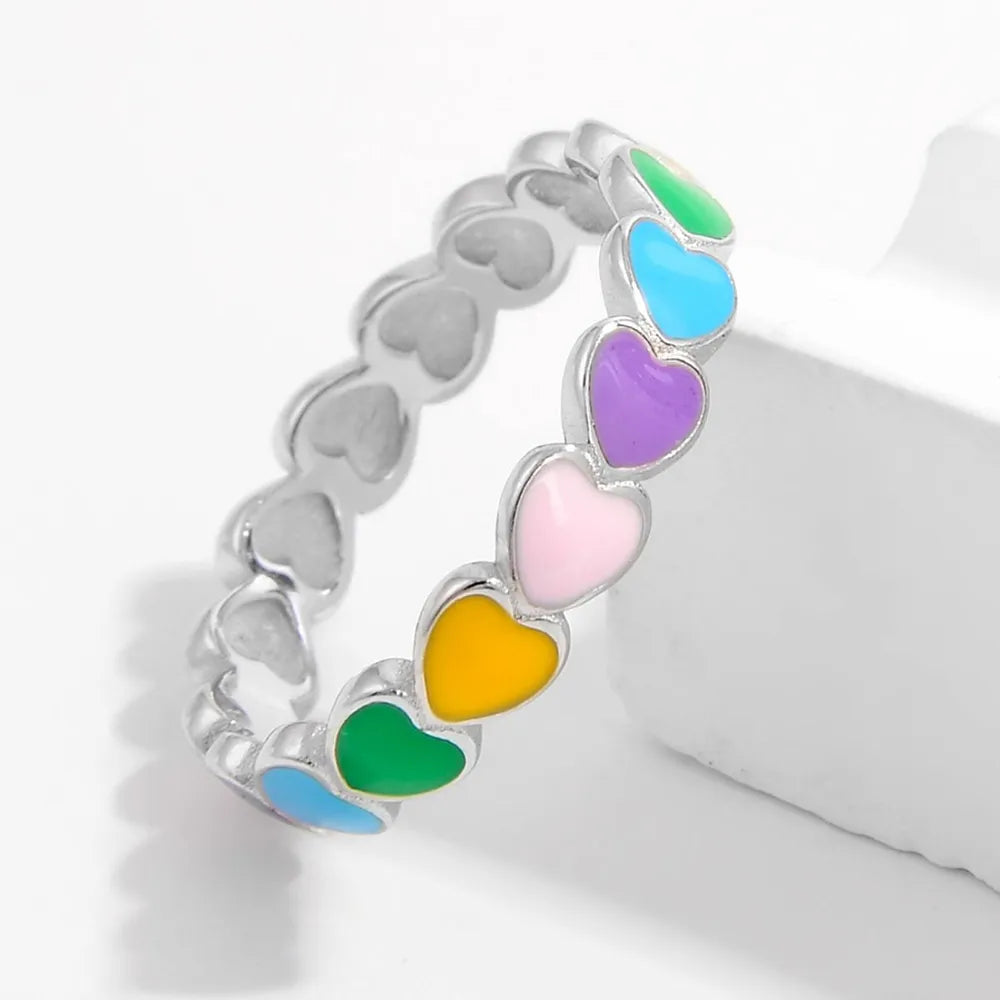 Colorful heart ring for women featuring multicolored hearts on a silver band