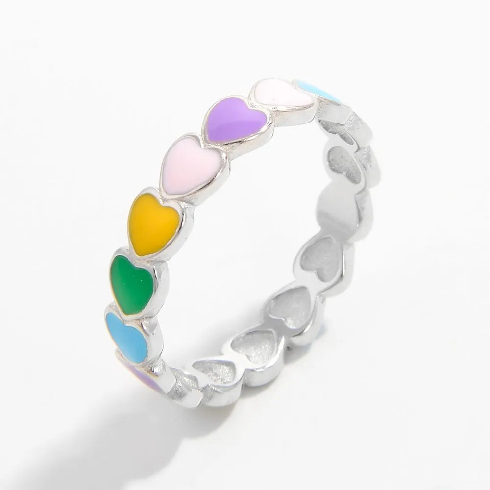 Colorful heart ring for women featuring multiple vibrant hearts in assorted colors around a silver band
