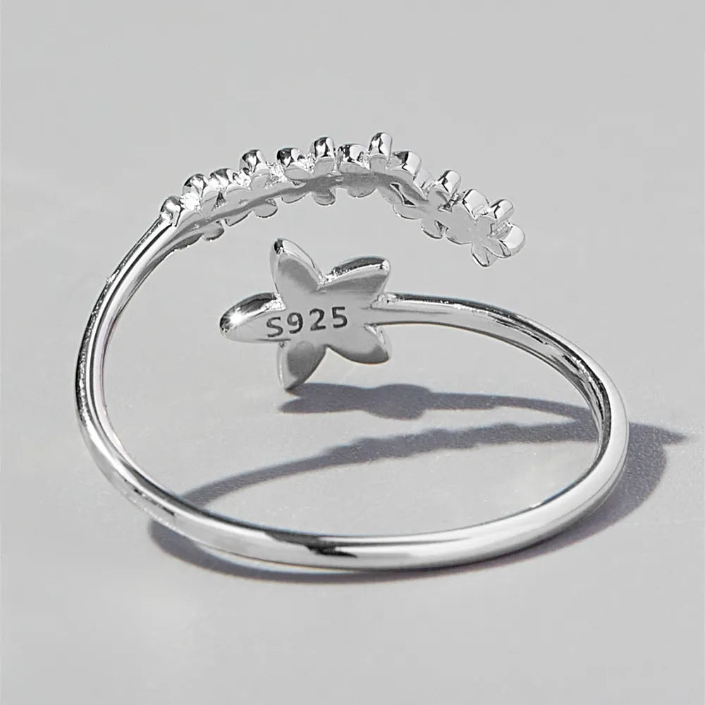 Delicate floral silver ring with a unique flower design and S925 marking for quality assurance