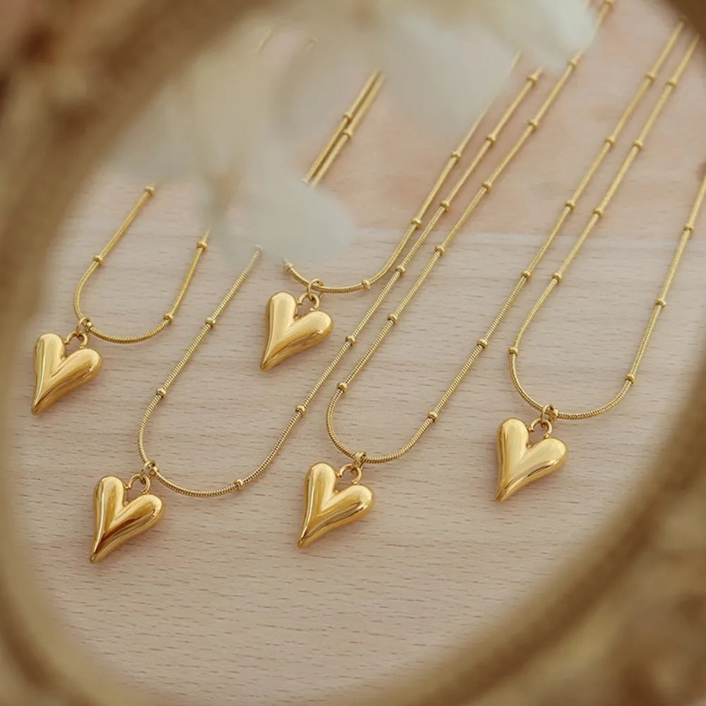 Trendsi durable heart pendant necklace in gold, featuring a unique heart design for everyday elegance