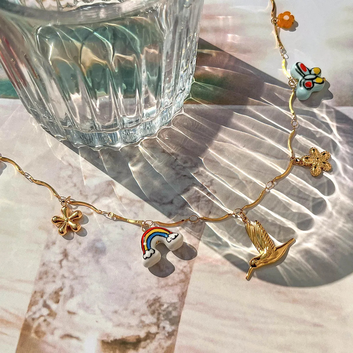 Trendsi elegant gold pendant necklace featuring colorful charms and delicate chain design