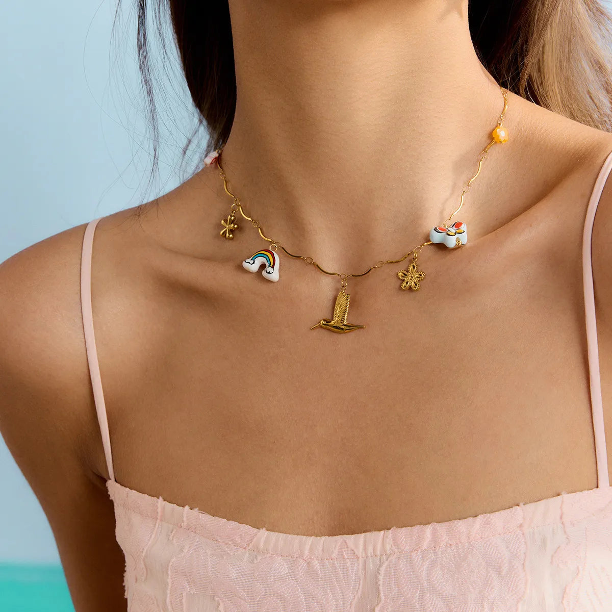 Trendy elegant gold pendant necklace featuring colorful charm designs for a stylish look