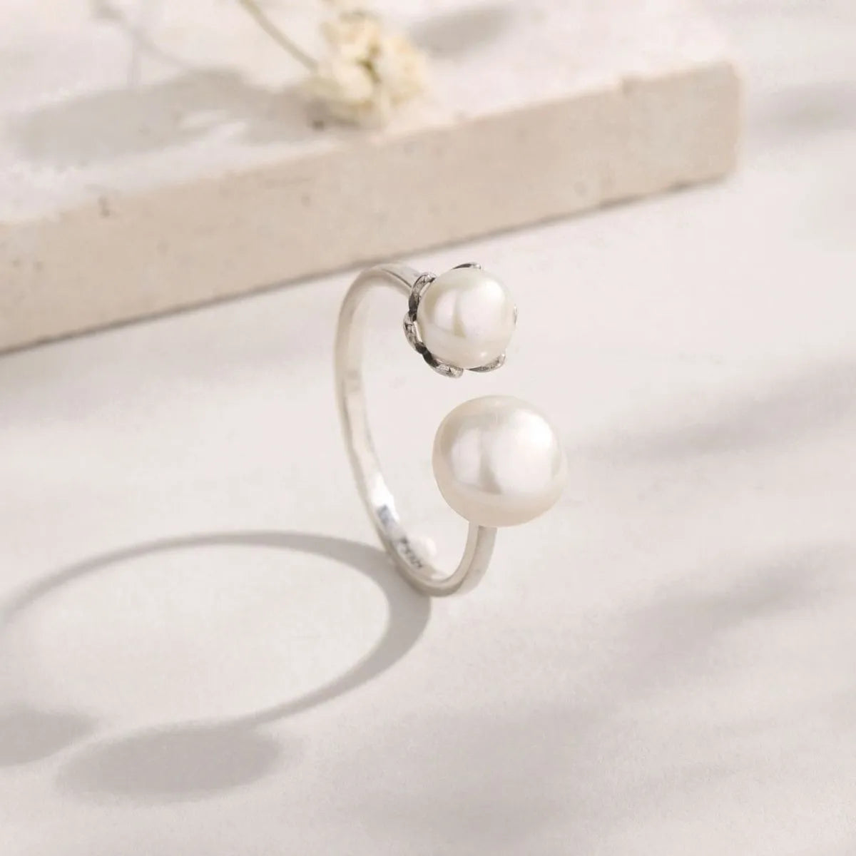 Trendsi elegant pearl jewelry ring featuring two beautiful pearls on a sleek silver band