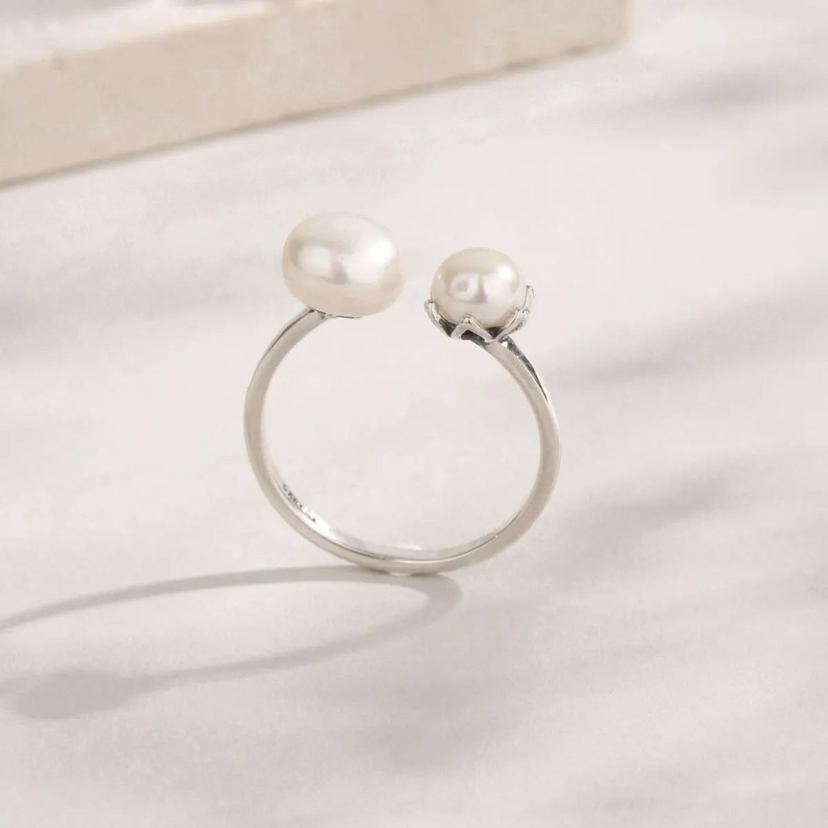 Trendsi elegant pearl jewelry ring featuring two lustrous pearls on a silver band