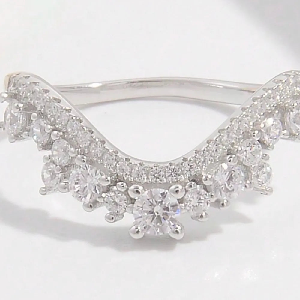 Elegant silver inlaid jewelry ring featuring intricate diamond-like detailing for a stunning look