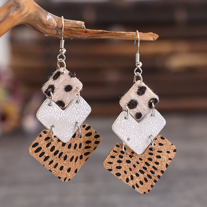 Trendy fashion earrings for women featuring leopard print and textured designs in neutral colors