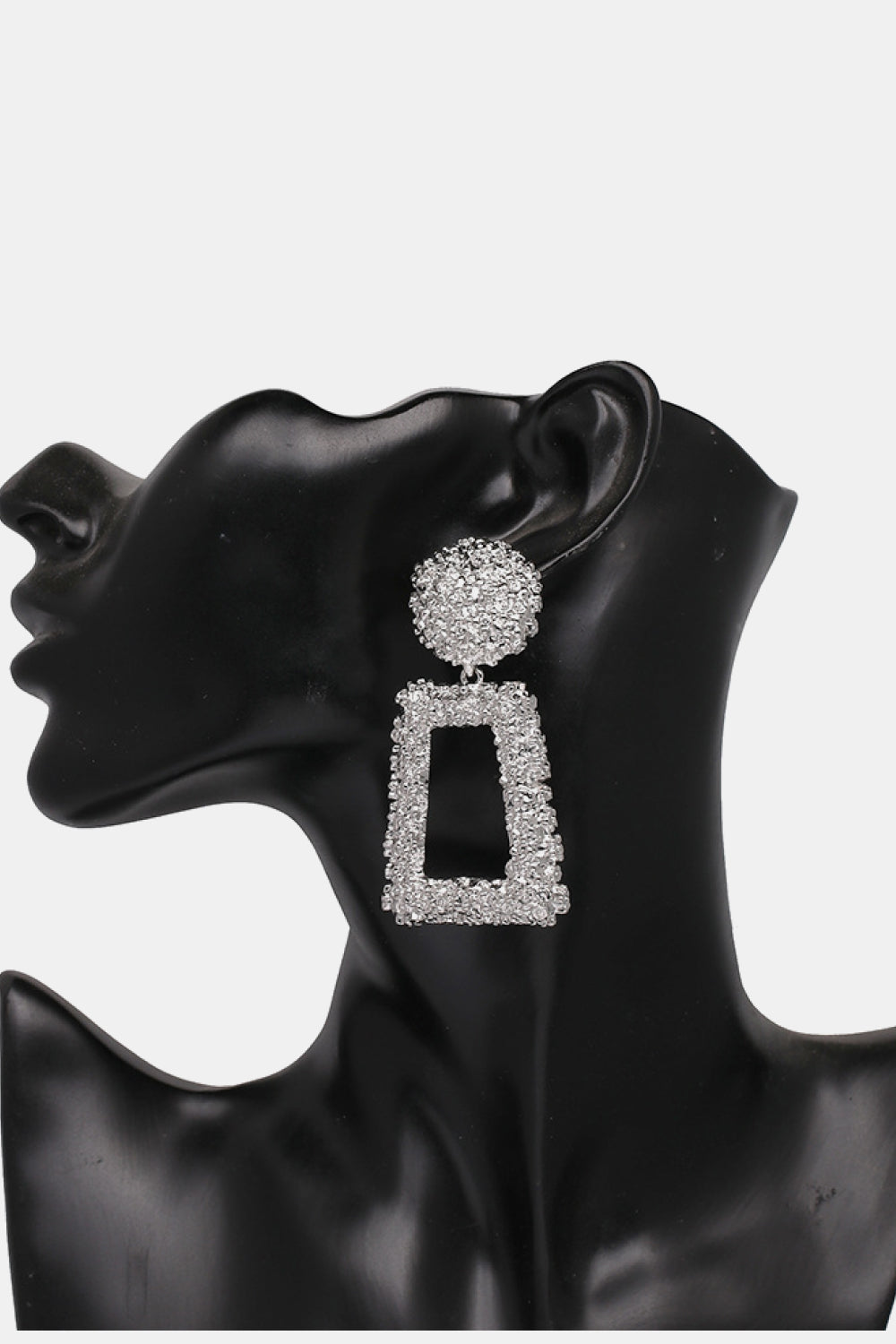 Trendy geometric dangle earrings in sparkling silver with unique shapes for a stylish look