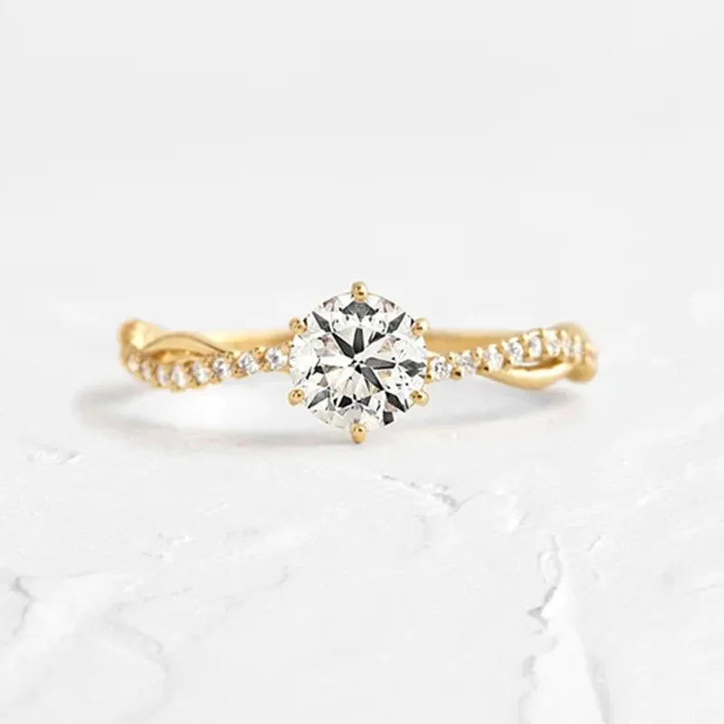 Elegant gold ring with a round diamond centerpiece and sparkling details showcasing glamorous silver rings