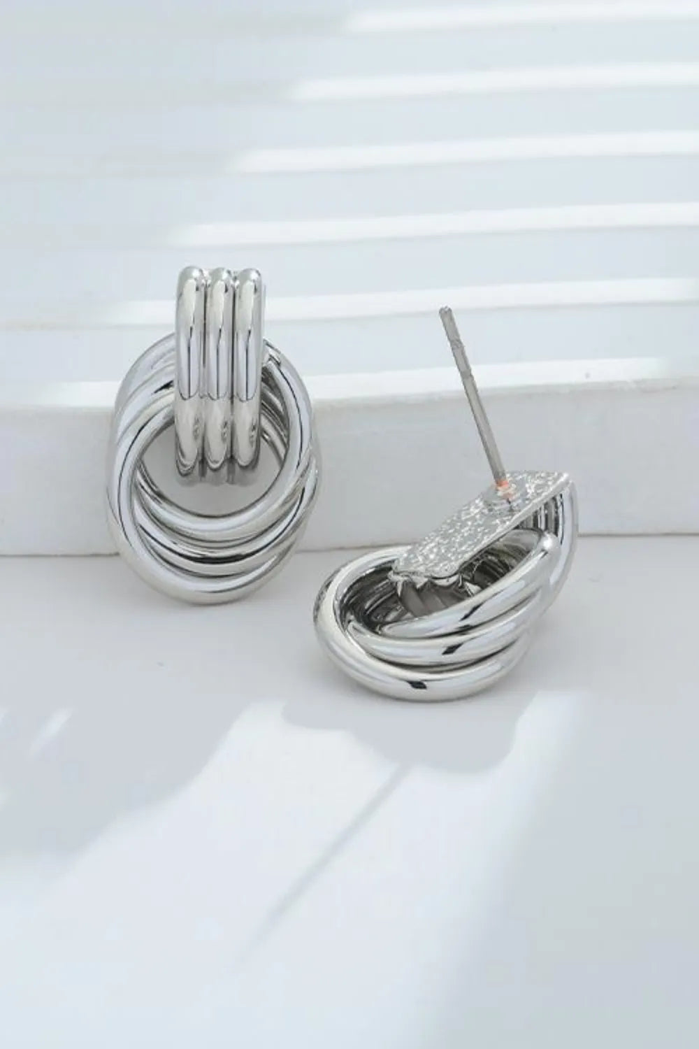 Trendsi gold-plated knot stud earrings with a unique intertwined design for elegant style