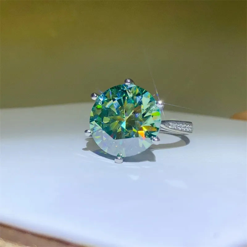 10 carat moissanite ring with a brilliant round cut and sparkling design on a white display