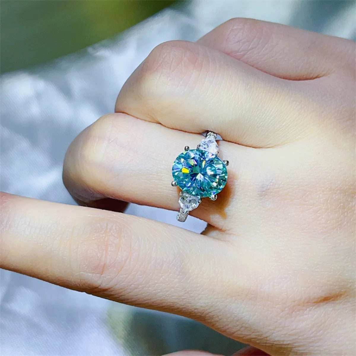 Stunning 5 Carat Moissanite Ring on a hand showcasing its vibrant sparkle and elegant design