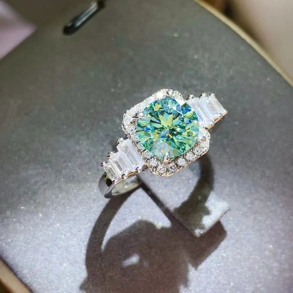Trendsi 3 carat moissanite engagement ring with a green center stone and baguette accents