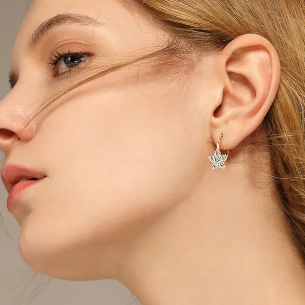 Elegant Moissanite flower earrings displayed on a model showcasing their sparkling design and delicate style