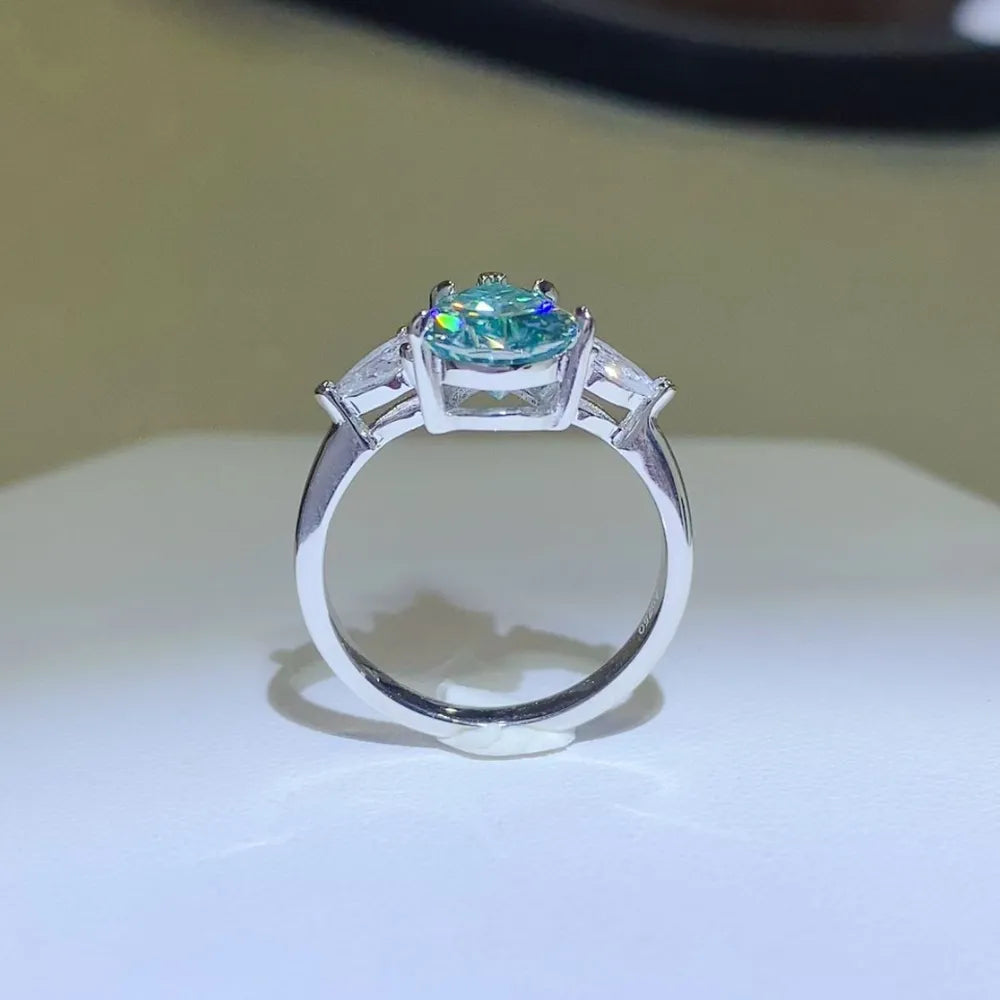 Elegant 2 carat moissanite silver ring featuring a vibrant gemstone with side accents
