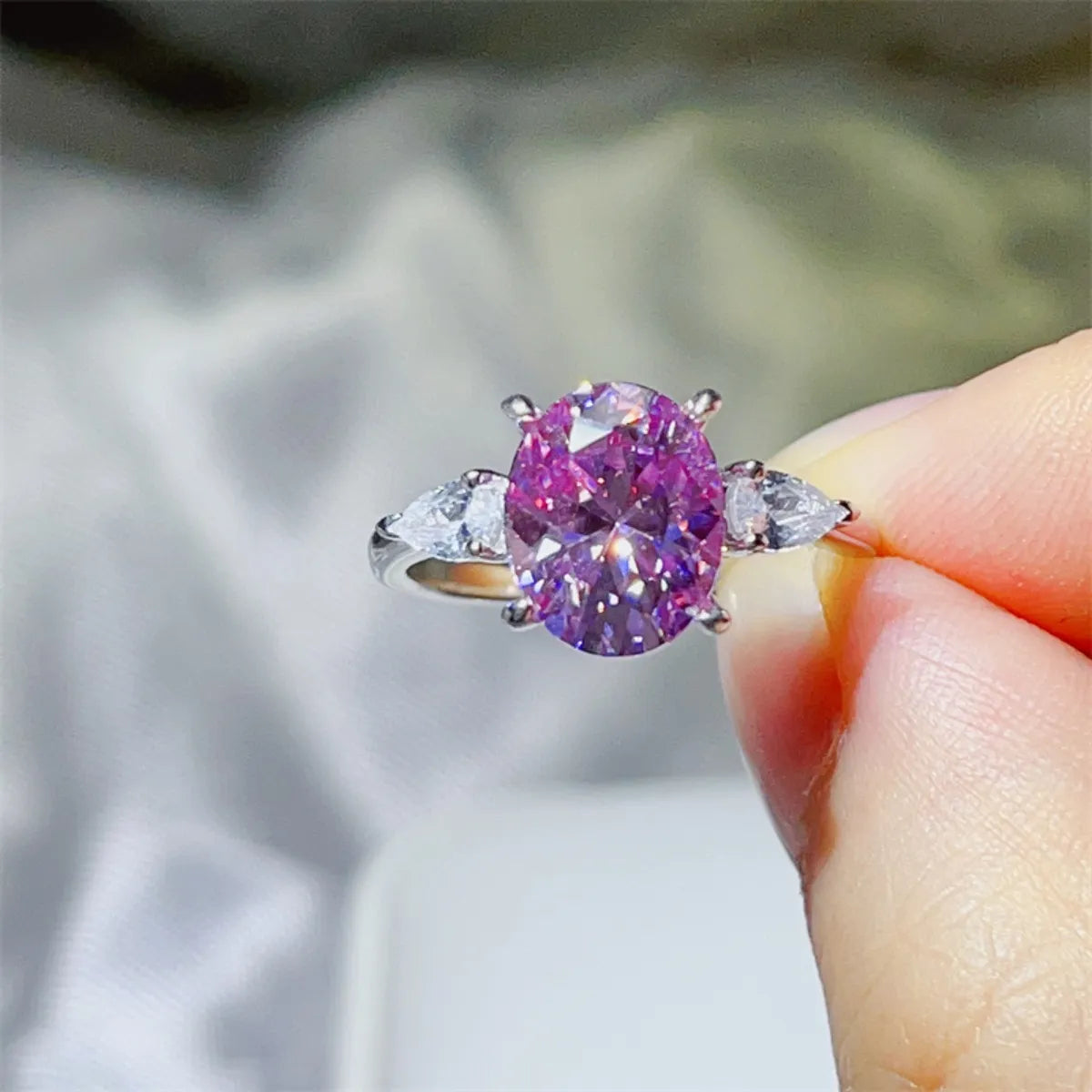 Stunning purple moissanite bridal jewelry ring with oval cut and side accents