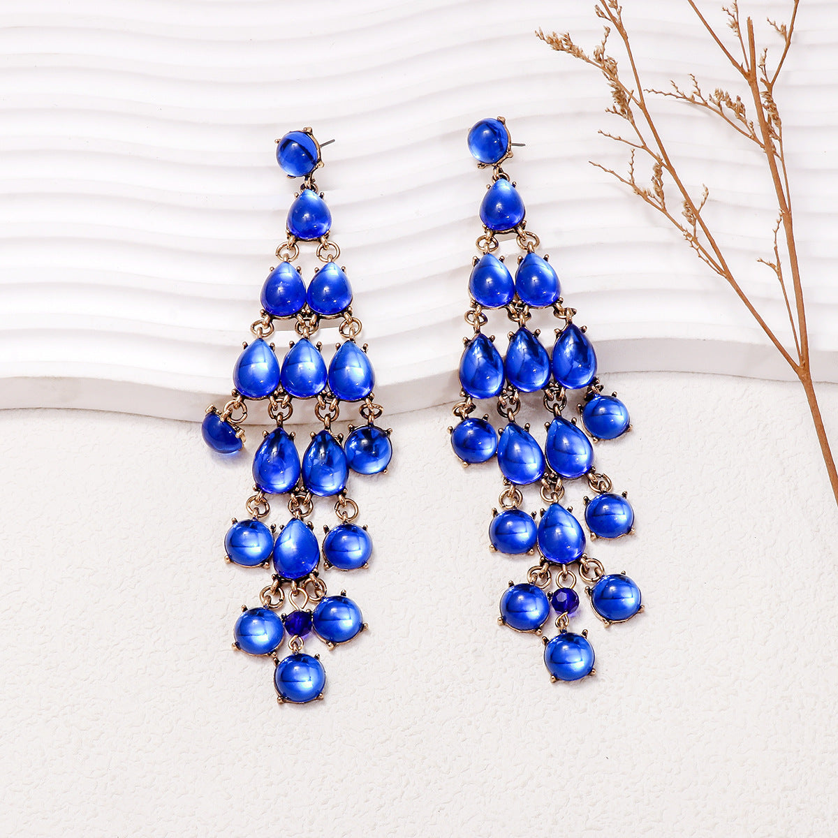 Elegant blue chandelier earrings featuring cascading teardrop stones for a stunning look
