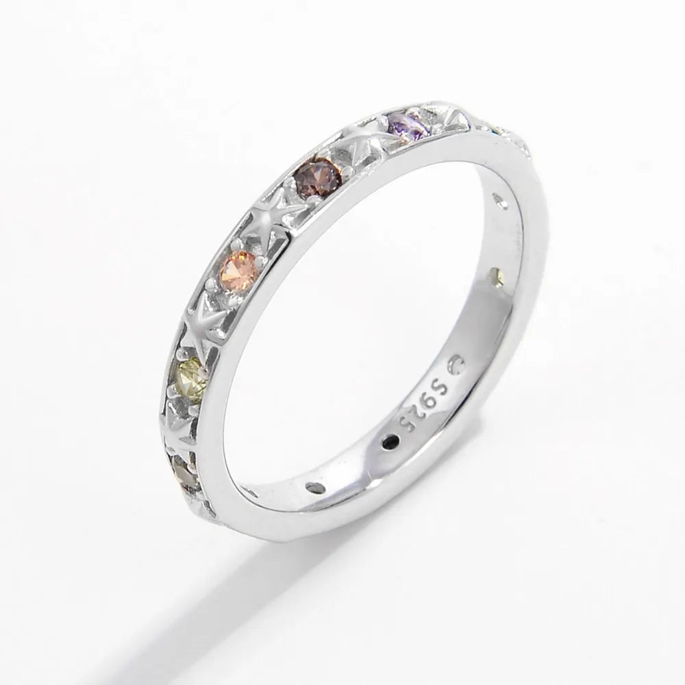 Sterling silver stacking ring with multicolored stones, perfect for creating layered looks