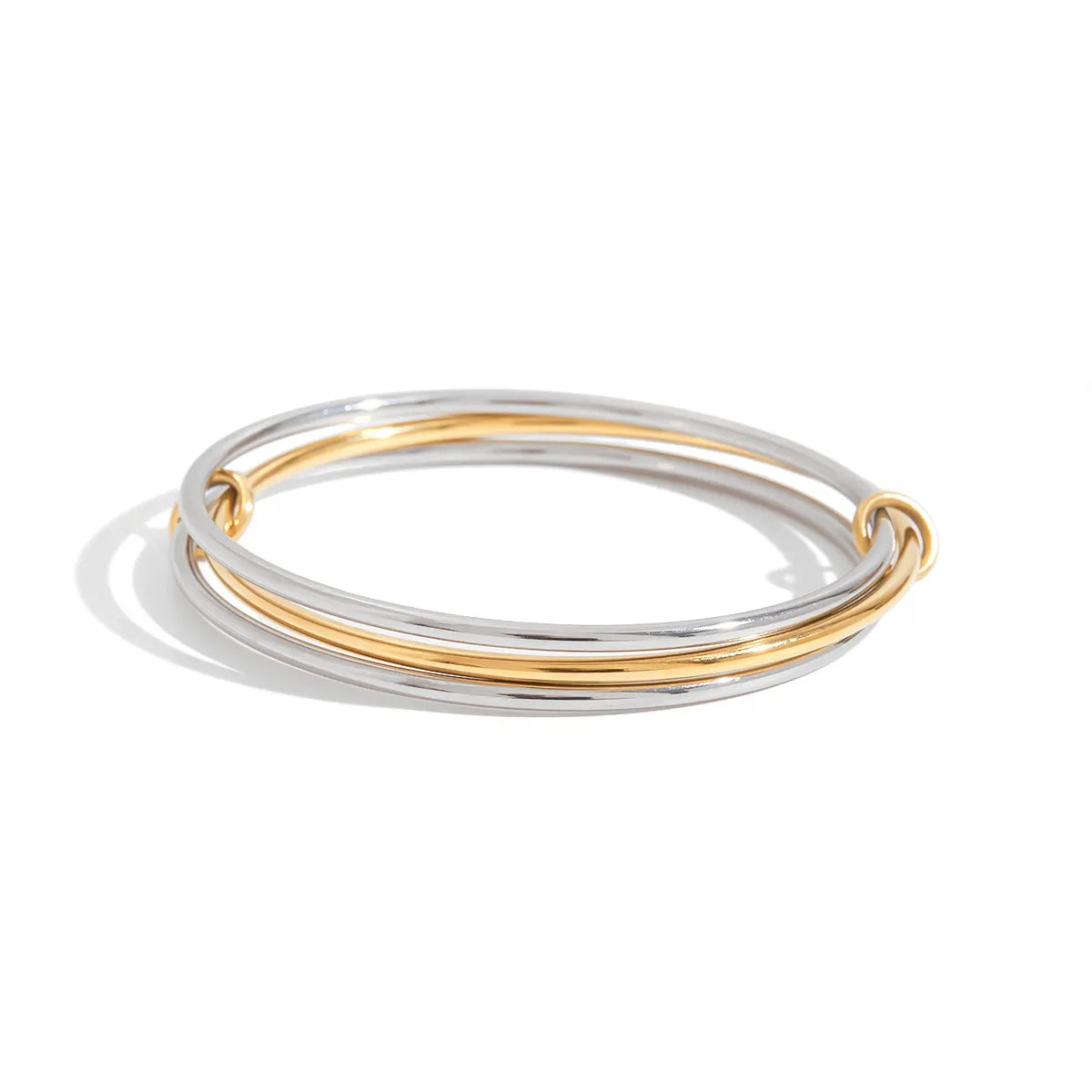Trendsi Two-Tone Bangle Bracelet featuring intertwined silver and gold tones for a stylish accessory