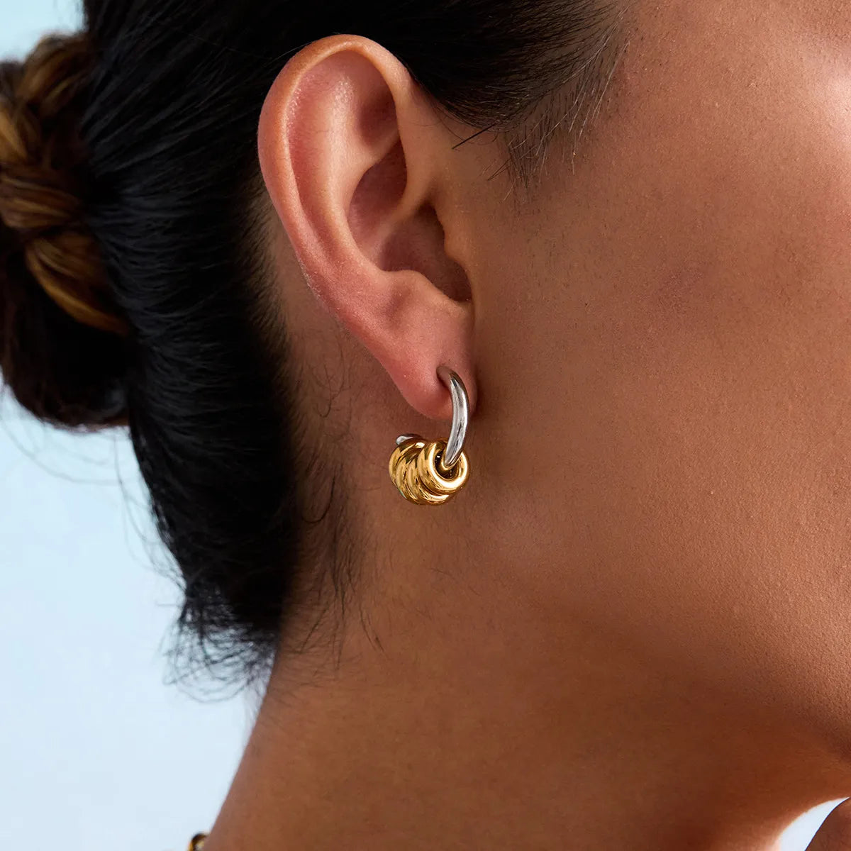 Trendsi two-tone hoop earrings featuring a sleek design in silver and gold colors