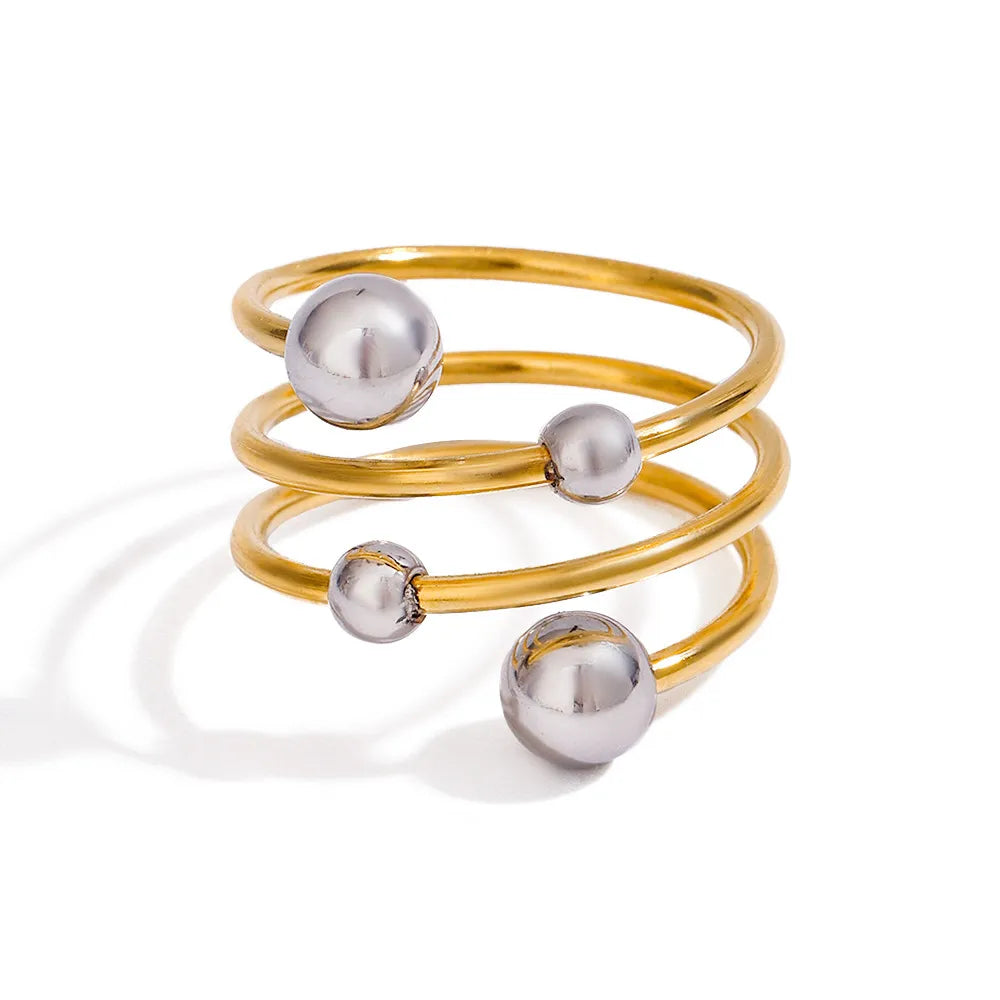 two-tone spiral ring featuring gold and silver tones with a stylish design