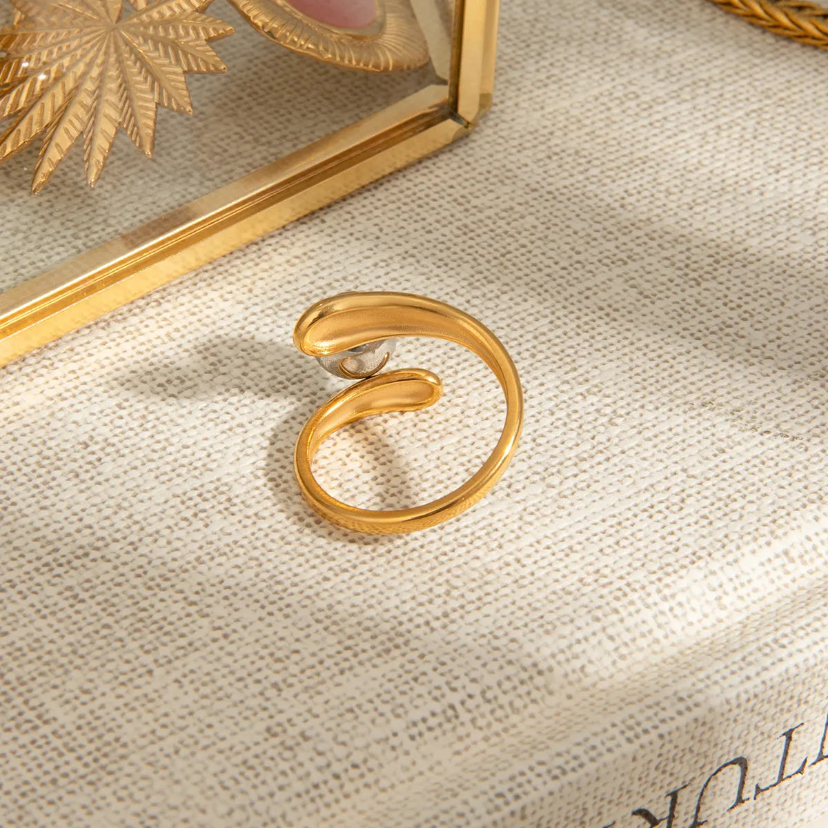 Two-tone twisted ring with a sleek design, perfect for stylish accessorizing