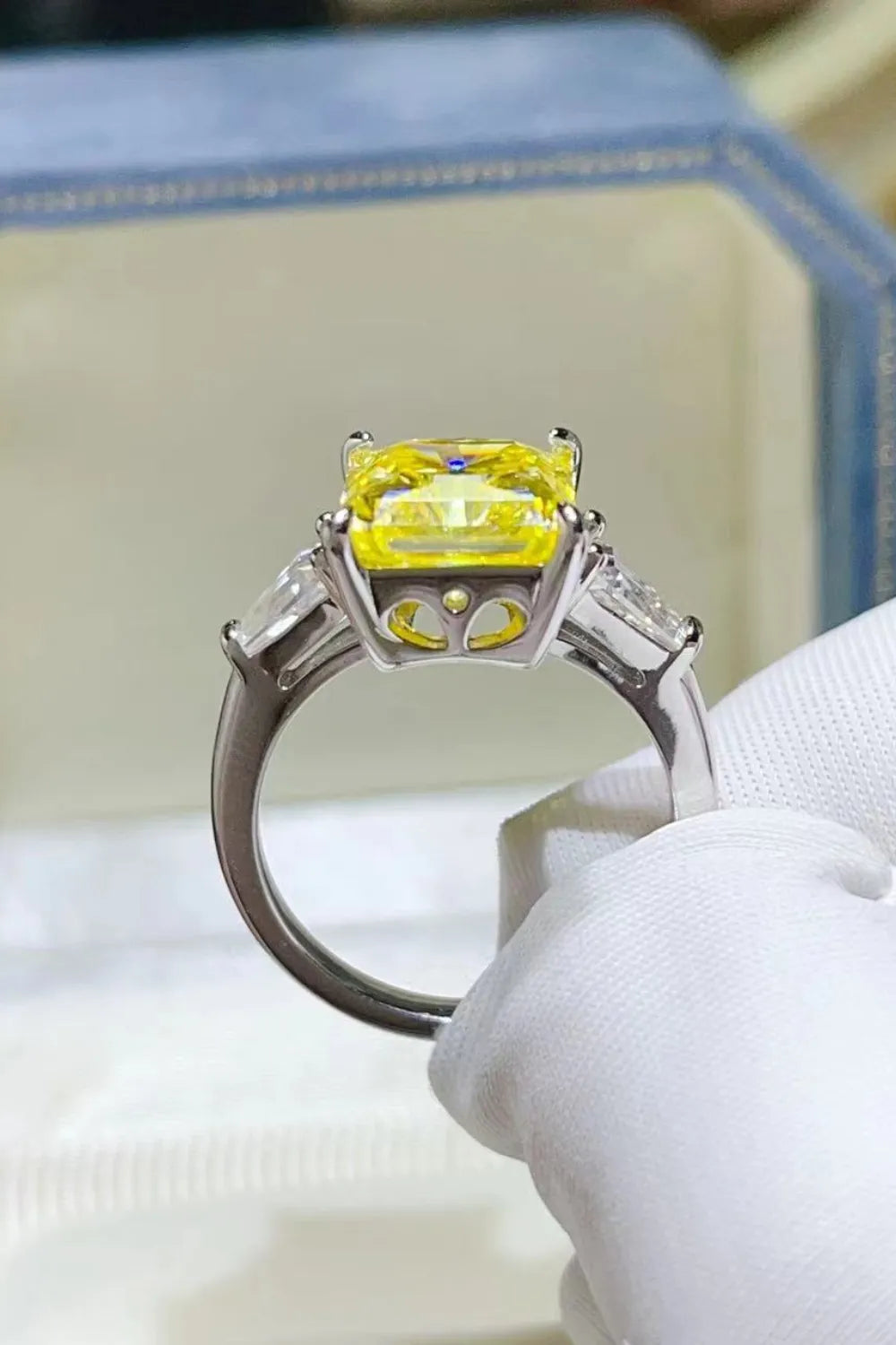 Unique engagement ring moissanite with a vibrant yellow stone set in elegant silver band