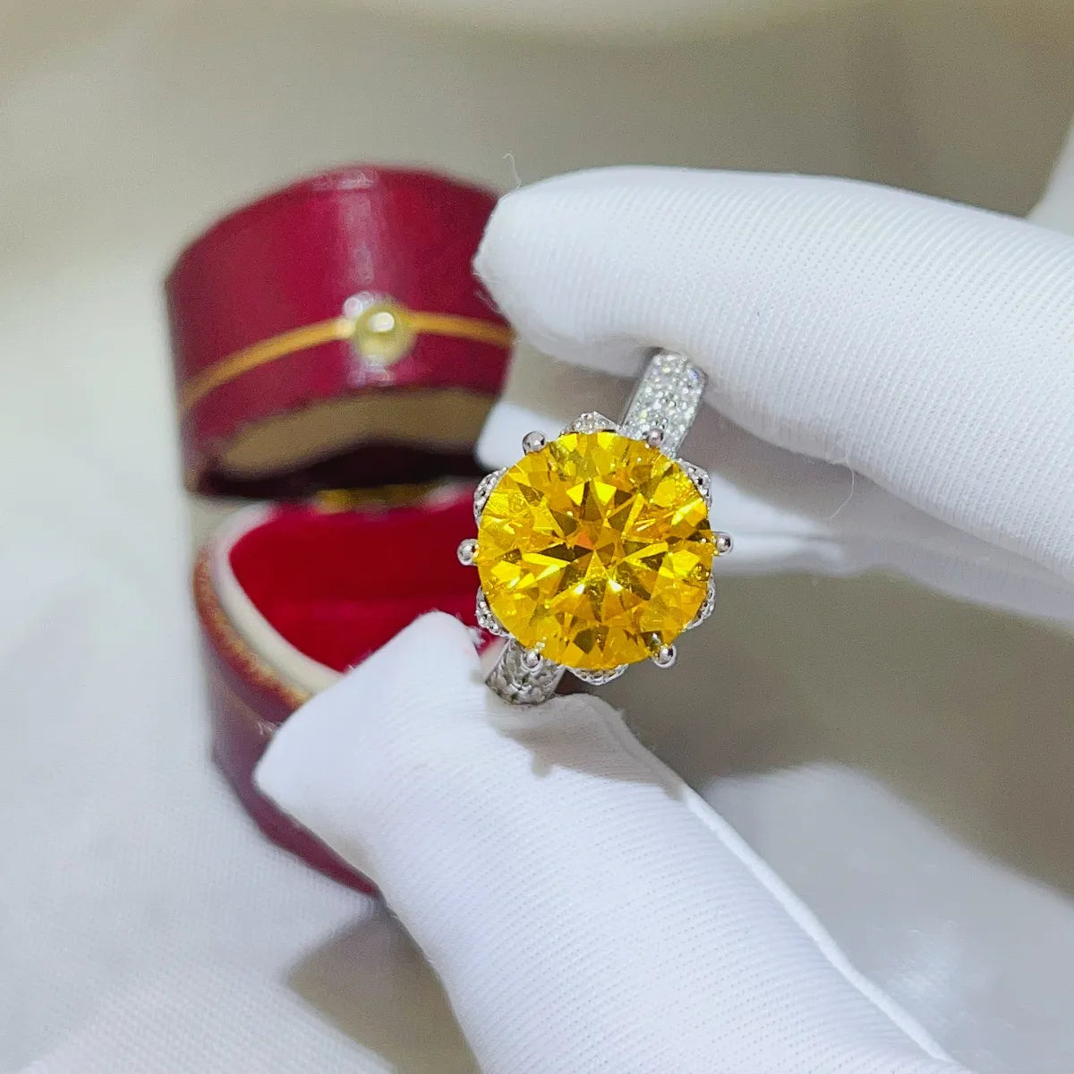 Elegant yellow moissanite ring set in a sparkling silver band with a detailed design